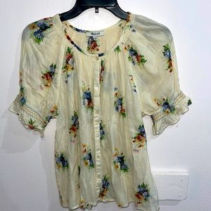 Blouse with smocked sleeves